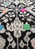 playing with tradition grey and black wool and silk hand knotted Rug - CloseUp playing with tradition grey and black wool and silk hand knotted Rug - CloseUp