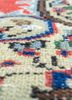 vintage red and orange wool hand knotted Rug - CloseUp