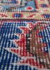 vintage red and orange wool hand knotted Rug - CloseUp vintage red and orange wool hand knotted Rug - CloseUp