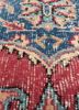 vintage red and orange wool hand knotted Rug - CloseUp vintage red and orange wool hand knotted Rug - CloseUp