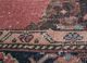 vintage red and orange wool hand knotted Rug - CloseUp vintage red and orange wool hand knotted Rug - CloseUp
