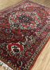 aalam red and orange wool hand knotted Rug - FoldShot aalam red and orange wool hand knotted Rug - FoldShot