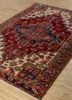 aalam red and orange wool hand knotted Rug - FoldShot aalam red and orange wool hand knotted Rug - FoldShot