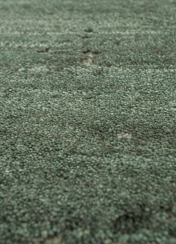 urban pause by kavi green wool hand knotted Rug - CloseUp