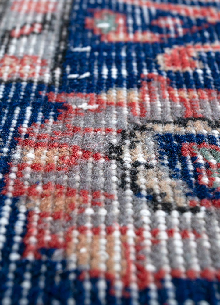 vintage red and orange wool hand knotted Rug - CloseUp