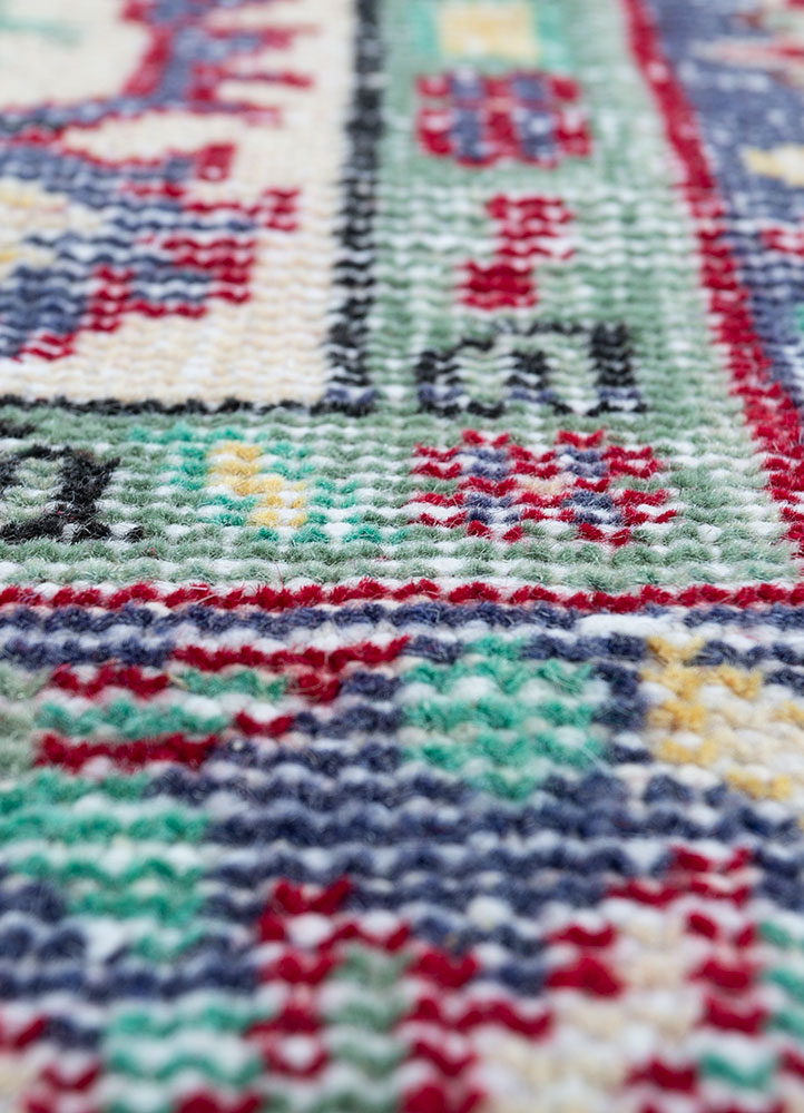 vintage red and orange wool hand knotted Rug - CloseUp