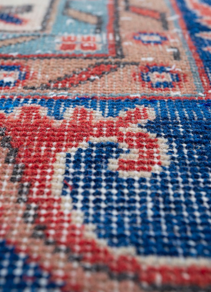 vintage red and orange wool hand knotted Rug - CloseUp