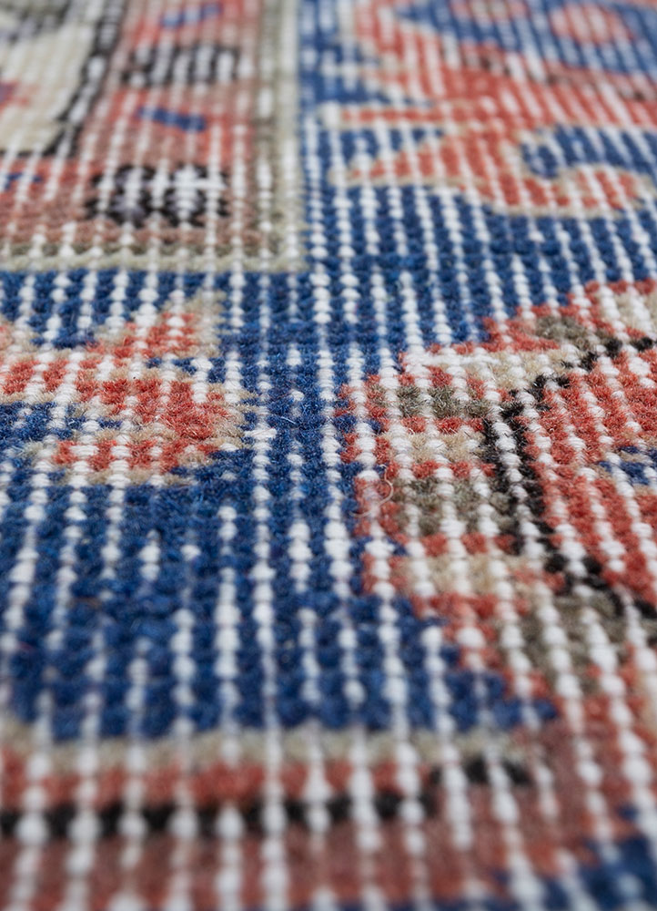 vintage red and orange wool hand knotted Rug - CloseUp