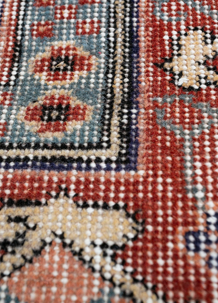 vintage red and orange wool hand knotted Rug - CloseUp
