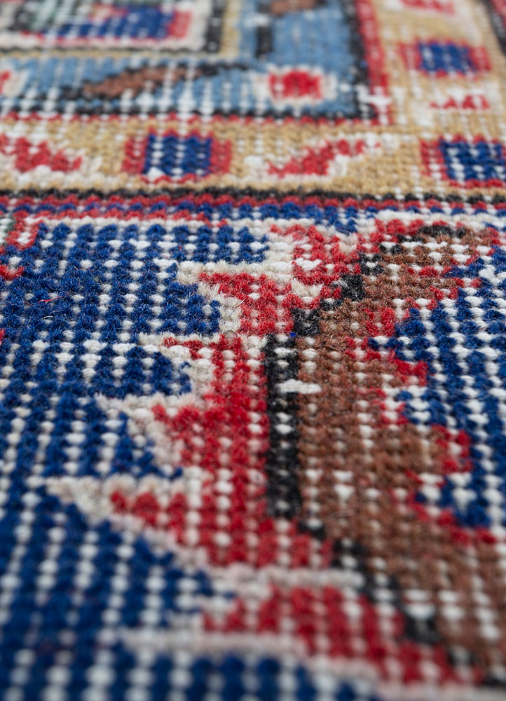 vintage red and orange wool hand knotted Rug - CloseUp