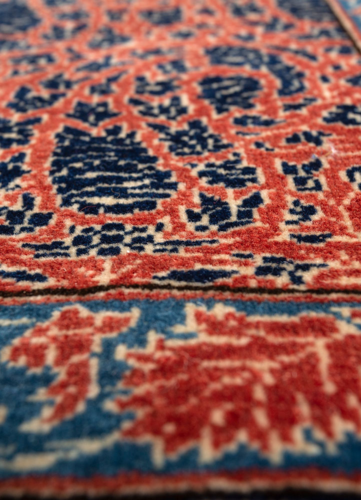 aalam red and orange wool hand knotted Rug - CloseUp