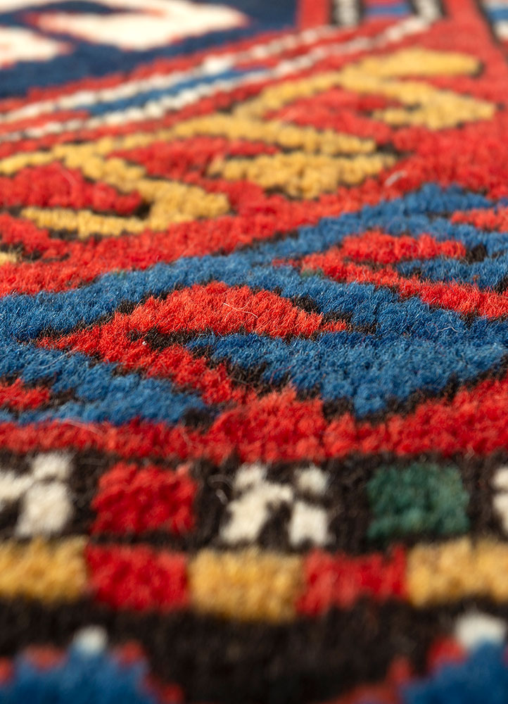 aalam red and orange wool hand knotted Rug - CloseUp