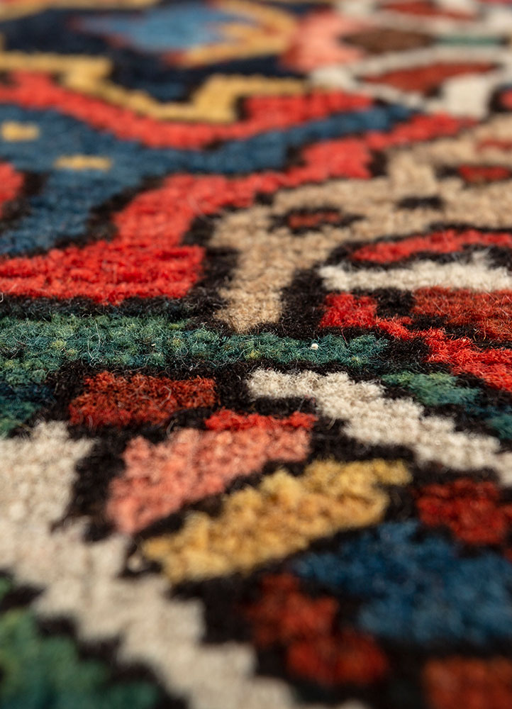 aalam red and orange wool hand knotted Rug - CloseUp