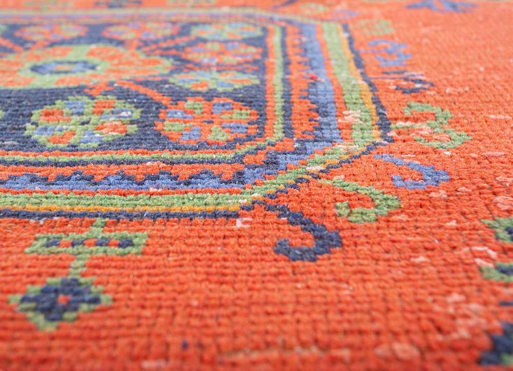 vintage red and orange wool hand knotted Rug - CloseUp