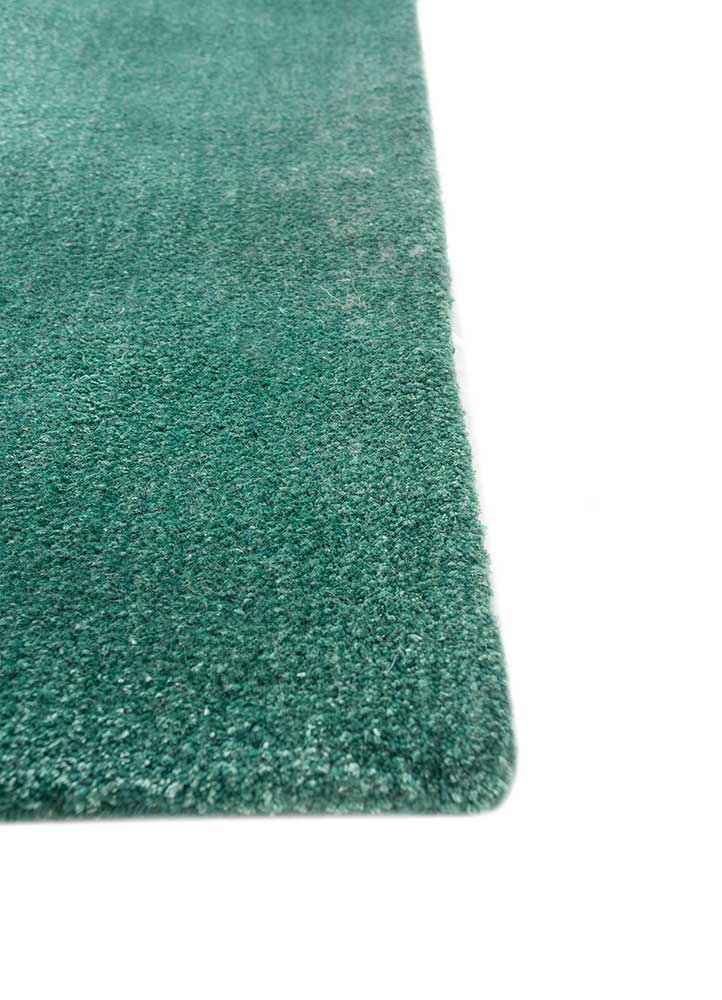 come around blue wool and viscose hand tufted Rug - Corner