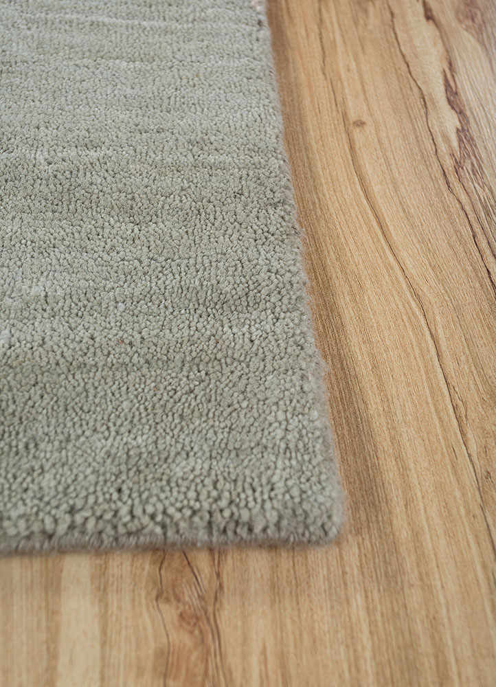 urban pause by kavi green wool and silk hand knotted Rug - Corner