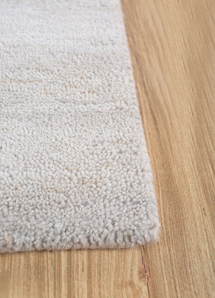 urban pause by kavi ivory wool and silk hand knotted Rug - Corner