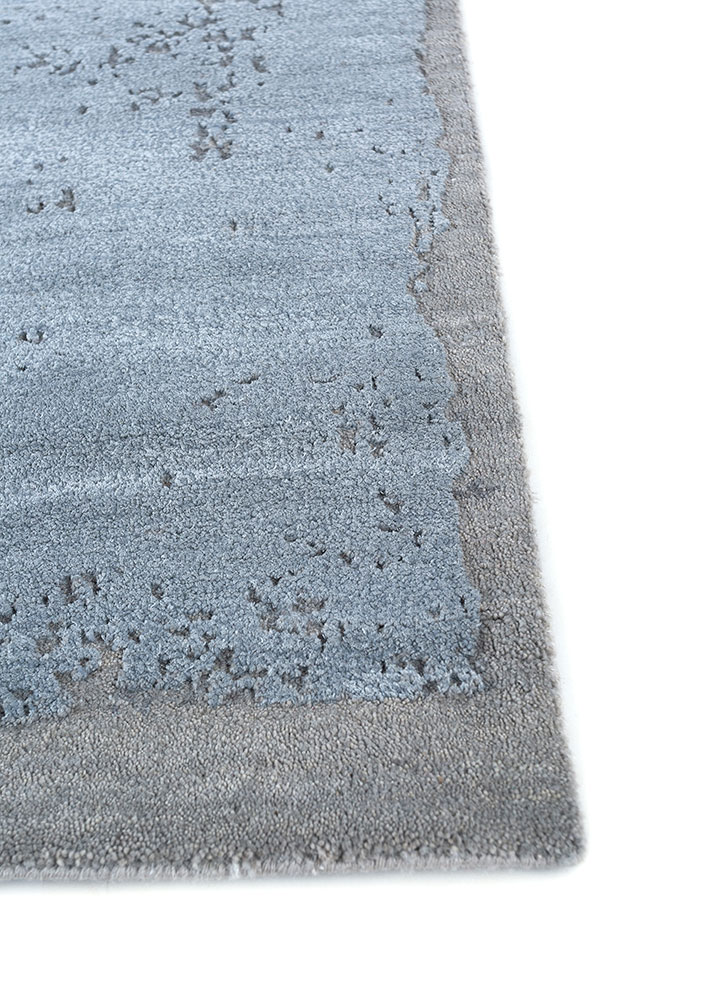 urban pause by kavi blue wool and silk hand knotted Rug - Corner