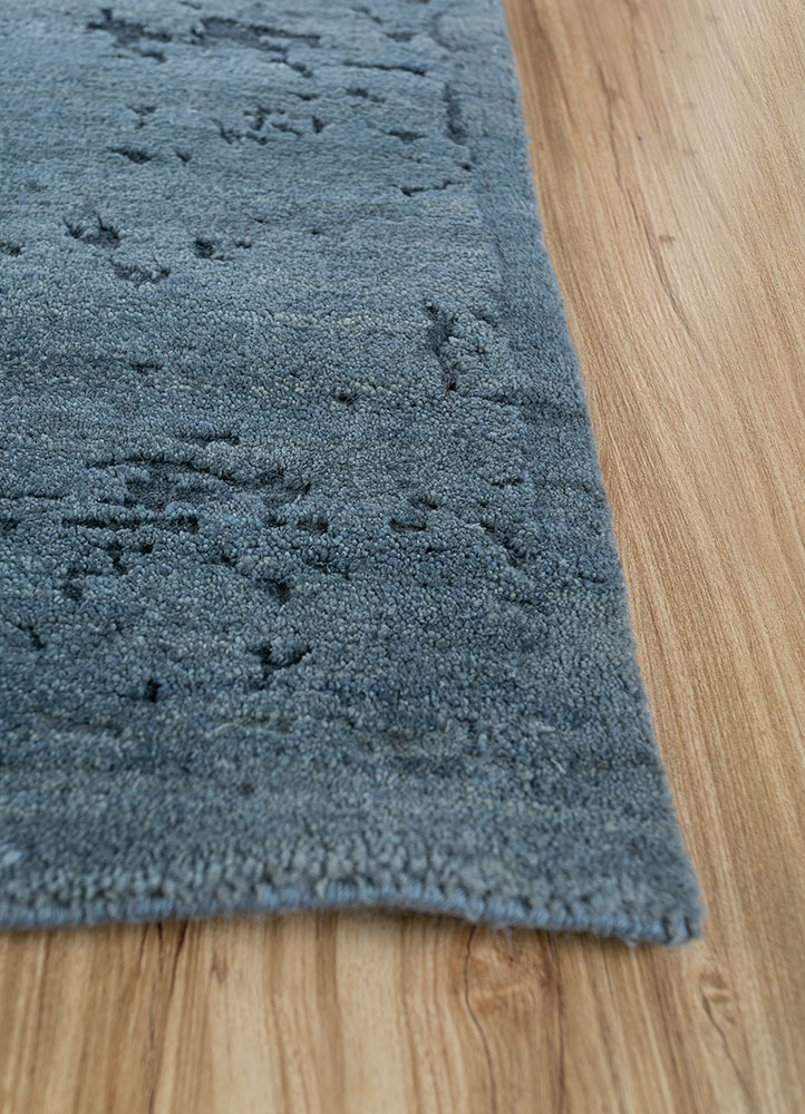 urban pause by kavi blue wool and silk hand knotted Rug - Corner