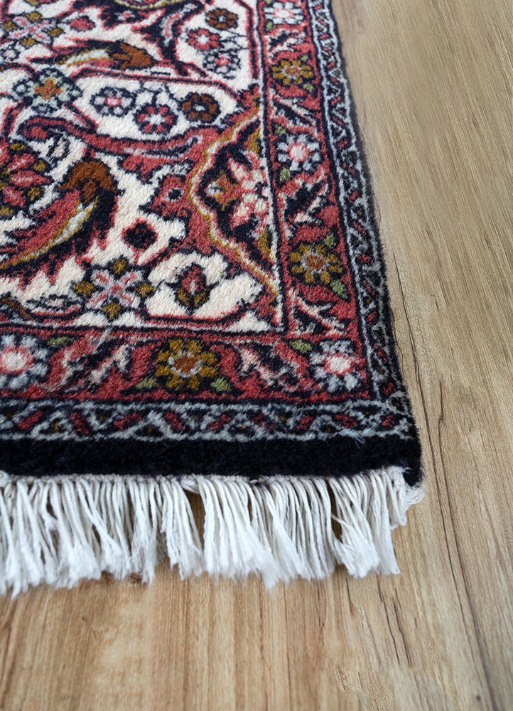 aalam red and orange wool hand knotted Rug - Corner