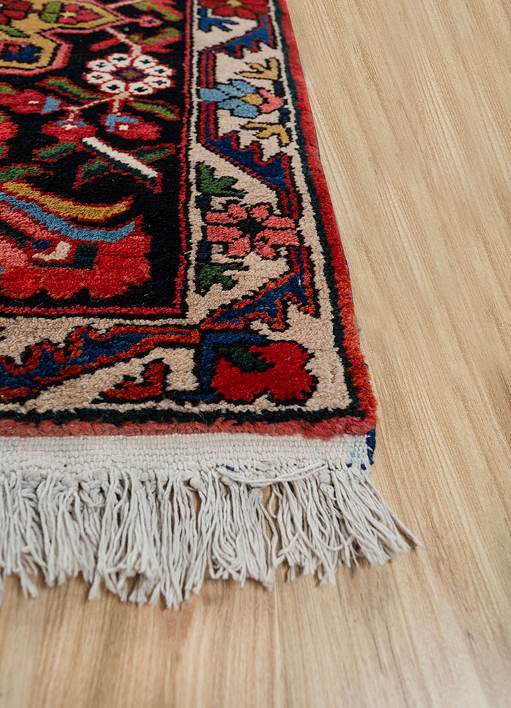 aalam red and orange wool hand knotted Rug - Corner