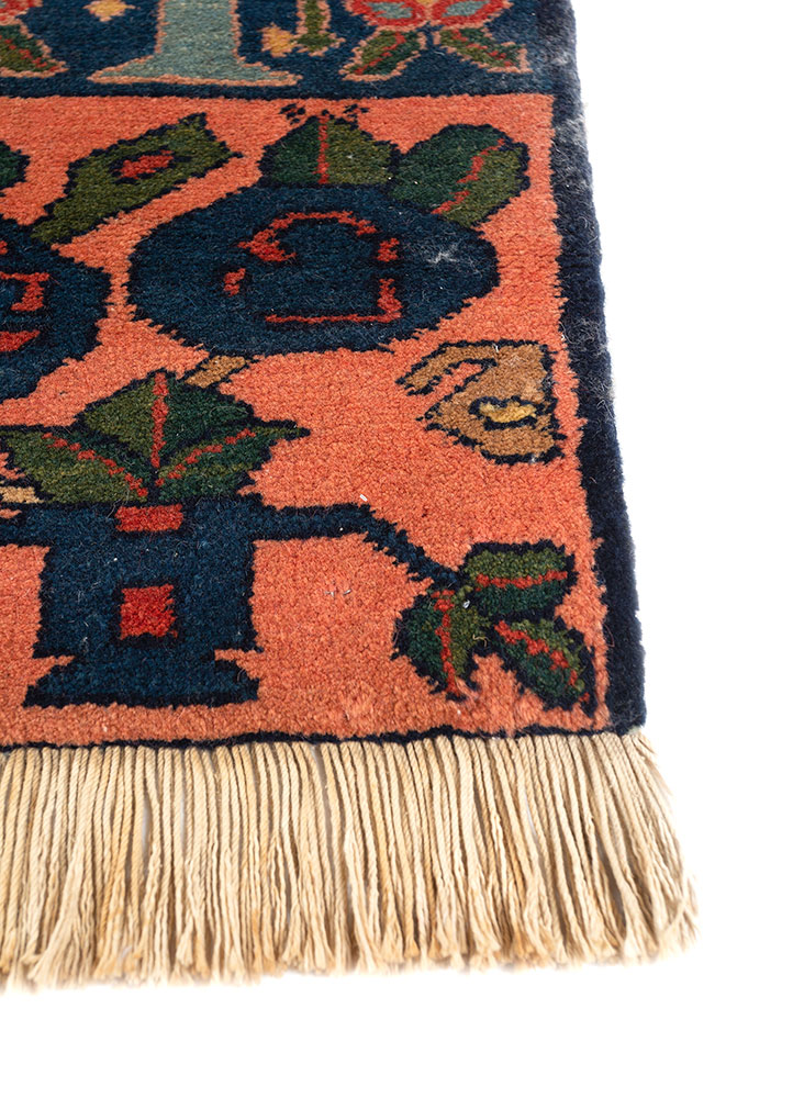 aalam red and orange wool hand knotted Rug - Corner