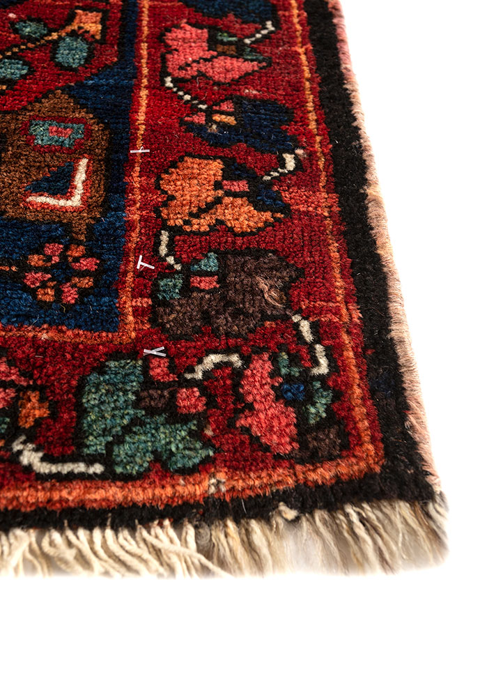 aalam red and orange wool hand knotted Rug - Corner