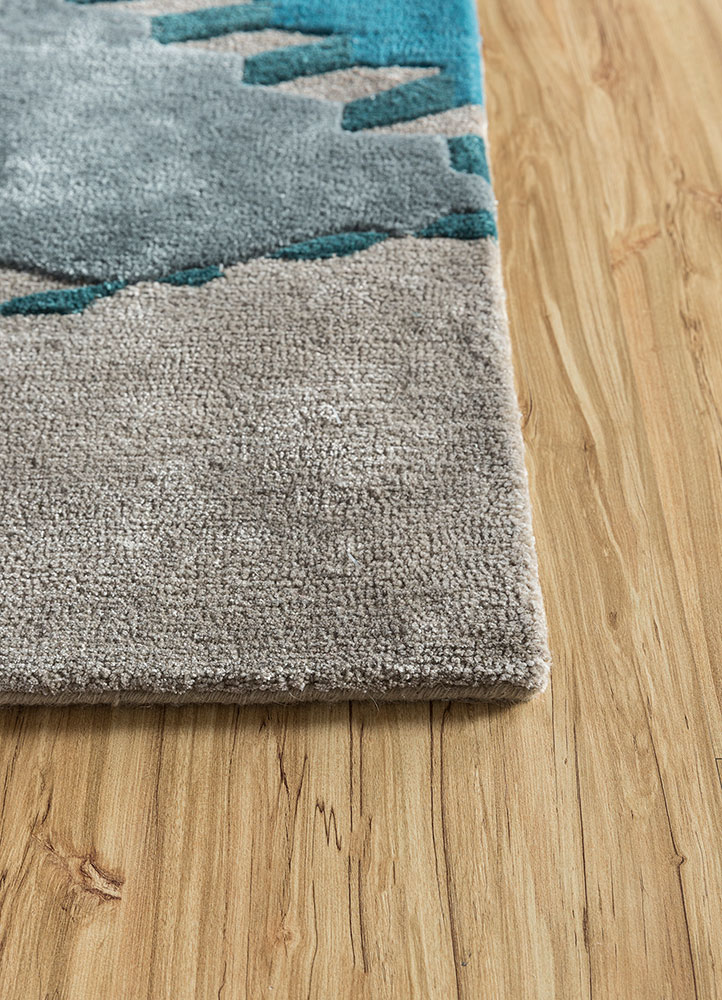 linear blue wool and viscose hand tufted Rug - Corner