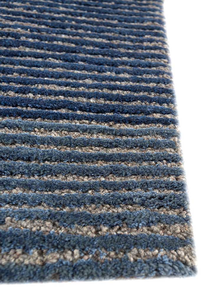 linear blue wool and viscose hand tufted Rug - Corner