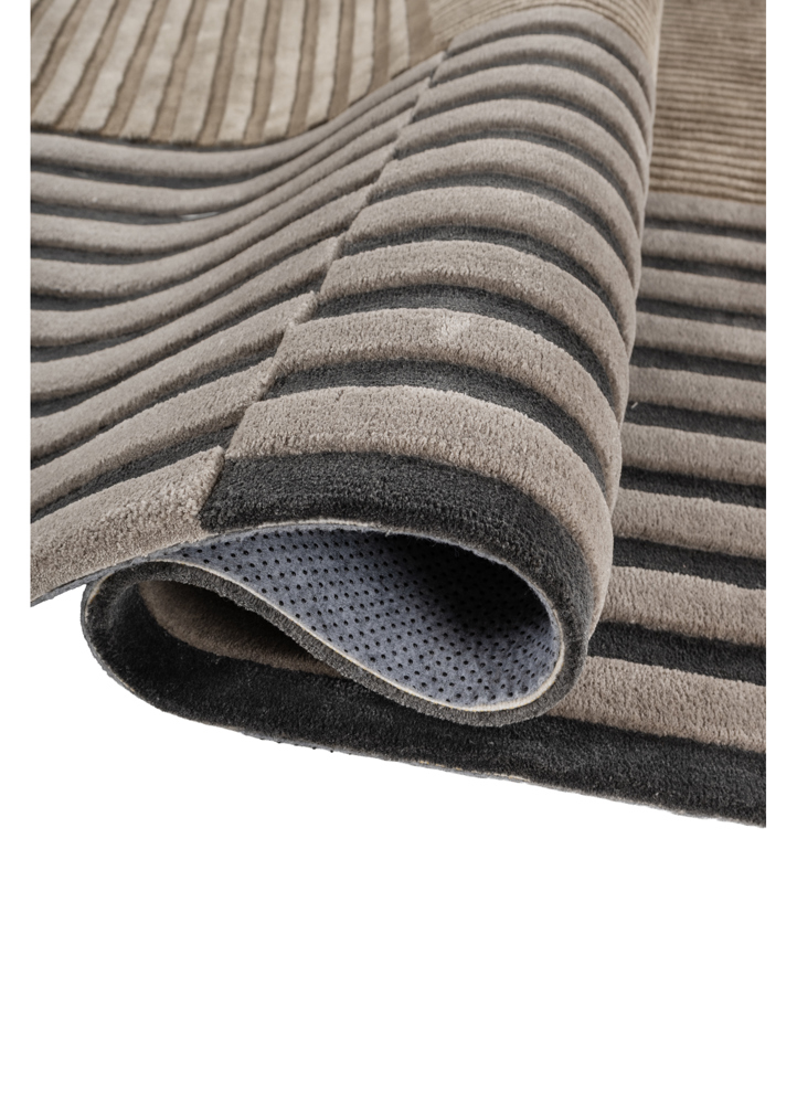 faces grey and black wool and viscose hand tufted Rug - FloorShot