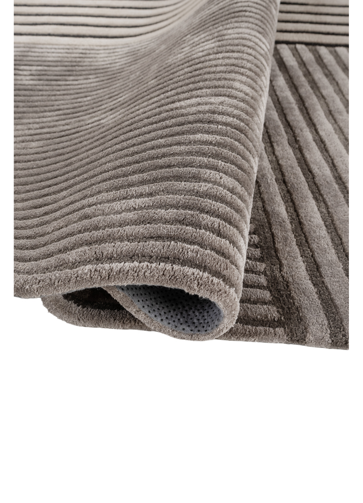 faces grey and black wool and viscose hand tufted Rug - FloorShot